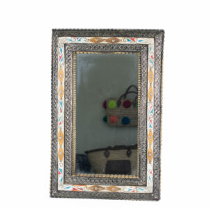 Moroccan mirror with bones engraved and colored set on the mosaic wall