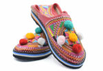 Moroccan Berber leather slippers decorated with colored pompom
