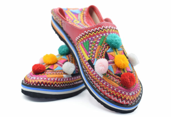 Moroccan Berber leather slippers decorated with colored pompom