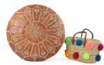 Moroccan leather pouf with straw pom pom basket