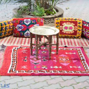 Vintage Boho throw pillows set on vintage rug and brass table in the middle
