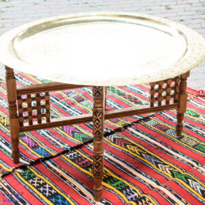 Round coffee table base shaped in X and folding with brass tray