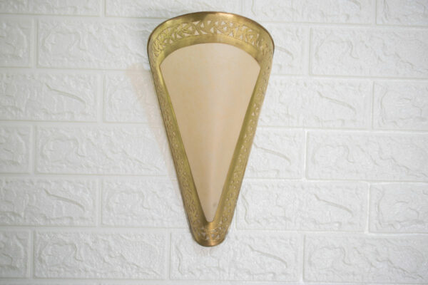 wall lamp made from brass hanging ion wall with white background
