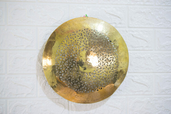 Wall sconce round shaped hanging on the white wall